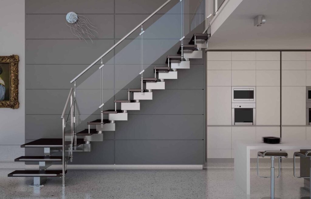 Custom-made glass staircase railing with stainless steel support in Dubai.