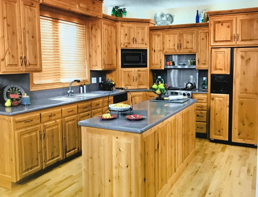 Wooden kitchen cabinets with natural oak finish in Dubai villa kitchen